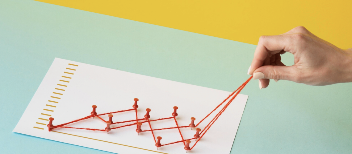 High angle of chart statistics presentation with hand